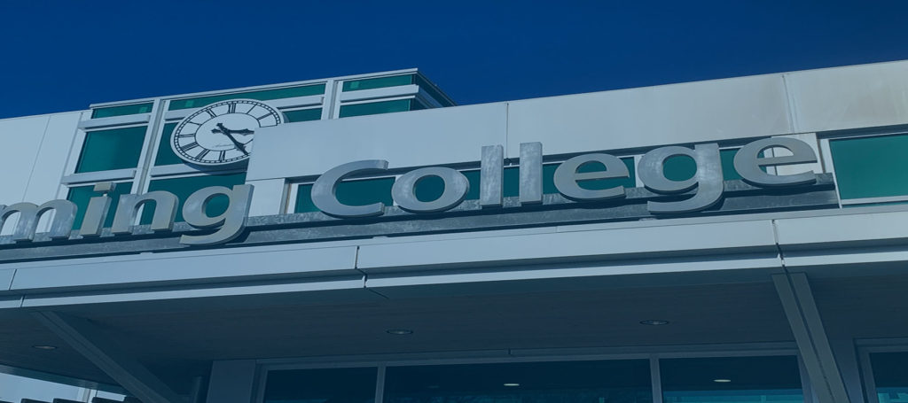 Fleming College entrance sign with blue filter